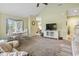 Spacious living room with large windows, neutral tones, and comfortable furnishings at 824 Castleford Circle # 7C, Myrtle Beach, SC 29572