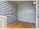 Cozy porch with wood flooring and gray siding, perfect for relaxing outdoors at 824 Castleford Circle # 7C, Myrtle Beach, SC 29572