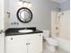 Bathroom with a modern vanity, toilet, round mirror and a shower at 890 Holly Sands Blvd., Little River, SC 29566