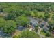 Aerial shot of the property showcasing the home's location near a golf course and nestled among lush trees at 907 Tidewater Dr., North Myrtle Beach, SC 29582