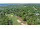 Aerial view of property, golf course, marshland, and the distant city skyline at 907 Tidewater Dr., North Myrtle Beach, SC 29582
