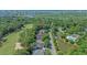 Aerial view of a home nestled in a golf course community with ponds, a golf course, and ocean views at 907 Tidewater Dr., North Myrtle Beach, SC 29582