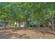 Charming home nestled among mature trees and lush landscaping, providing a private and serene setting at 907 Tidewater Dr., North Myrtle Beach, SC 29582