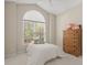 Bedroom with large window, a ceiling fan, and a wooden dresser at 907 Tidewater Dr., North Myrtle Beach, SC 29582