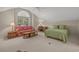 Upstairs bedroom features high ceilings, a large window, and sitting area at 907 Tidewater Dr., North Myrtle Beach, SC 29582