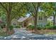 Charming home featuring a lush, mature landscape and a welcoming front entrance at 907 Tidewater Dr., North Myrtle Beach, SC 29582