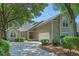Attractive home featuring a driveway and mature landscaping at 907 Tidewater Dr., North Myrtle Beach, SC 29582