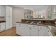 Kitchen with white cabinets, granite countertops, and an open layout design at 907 Tidewater Dr., North Myrtle Beach, SC 29582