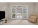 Living room with an attached sun room featuring floor to ceiling windows with a view at 907 Tidewater Dr., North Myrtle Beach, SC 29582
