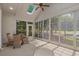 Relaxing sunroom featuring large windows, skylights, and a ceiling fan at 907 Tidewater Dr., North Myrtle Beach, SC 29582