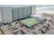 Aerial view of a condominium, tennis courts, and parking area near the ocean at 9400 Shore Dr. # 716, Myrtle Beach, SC 29572