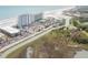 Aerial view of condos, beach, and marsh, showcasing the coastal location at 9400 Shore Dr. # 716, Myrtle Beach, SC 29572
