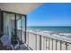 Balcony with ocean view, seating, and beach access, perfect for enjoying the coastal scenery at 9400 Shore Dr. # 716, Myrtle Beach, SC 29572