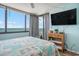 Bedroom featuring an ocean view, flat screen TV, and access to the balcony at 9400 Shore Dr. # 716, Myrtle Beach, SC 29572