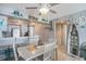 Bright dining area features coastal decor and a ceiling fan at 9400 Shore Dr. # 716, Myrtle Beach, SC 29572