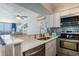 Modern kitchen with stainless steel appliances and bright countertops at 9400 Shore Dr. # 716, Myrtle Beach, SC 29572