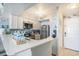 Kitchen featuring white cabinetry and modern appliances with an adjacent entry door at 9400 Shore Dr. # 716, Myrtle Beach, SC 29572