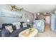 Comfortable living room open to kitchen, with nautical decor and ocean views at 9400 Shore Dr. # 716, Myrtle Beach, SC 29572