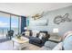 Cozy living room with ocean view, comfortable seating, and coastal decor at 9400 Shore Dr. # 716, Myrtle Beach, SC 29572