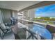 Condo balcony seating area with great views of the ocean and green lawn at 9840 Queensway Blvd. # 331, Myrtle Beach, SC 29572