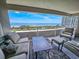 Enjoy ocean views from this private balcony with comfortable seating and table for relaxing at 9840 Queensway Blvd. # 331, Myrtle Beach, SC 29572