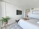 Comfortable bedroom featuring a modern TV, stylish decor, and a calming atmosphere for restful nights at 9840 Queensway Blvd. # 331, Myrtle Beach, SC 29572
