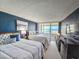 Comfortable bedroom with two beds and sliding glass doors to a balcony overlooking the ocean at 9840 Queensway Blvd. # 331, Myrtle Beach, SC 29572