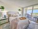Serene bedroom with a plush bed, coastal decor, and access to a private balcony with ocean views at 9840 Queensway Blvd. # 331, Myrtle Beach, SC 29572