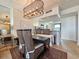 Dining area features a modern chandelier, stylish decor, and a glimpse into the modern kitchen at 9840 Queensway Blvd. # 331, Myrtle Beach, SC 29572
