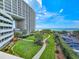 High-rise condo features a beautiful green space with manicured lawns and sidewalks at 9840 Queensway Blvd. # 331, Myrtle Beach, SC 29572