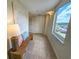 Inviting hallway with stylish decor, a cozy bench, and a large window offering bright natural light at 9840 Queensway Blvd. # 331, Myrtle Beach, SC 29572