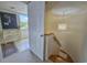 Bright hallway featuring a staircase and a view through an open doorway at 9840 Queensway Blvd. # 331, Myrtle Beach, SC 29572