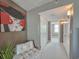 Hallway with carpet, artwork and leading to laundry area with a window at 9840 Queensway Blvd. # 331, Myrtle Beach, SC 29572
