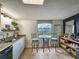 Well-lit kitchen with granite countertops, stainless steel appliances and seating area at 9840 Queensway Blvd. # 331, Myrtle Beach, SC 29572
