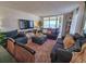 Cozy living room with plush seating, a flat-screen TV, and sliding glass doors to a balcony with ocean views at 9840 Queensway Blvd. # 331, Myrtle Beach, SC 29572