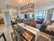 Living room offers comfortable seating, a large flatscreen TV, and stunning ocean views at 9840 Queensway Blvd. # 331, Myrtle Beach, SC 29572