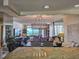 Relaxing living room with large windows showcasing an ocean view, complemented by a stylish chandelier at 9840 Queensway Blvd. # 331, Myrtle Beach, SC 29572