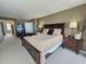 Bedroom featuring king bed, neutral decor, and dresser with bedside lamps at 9840 Queensway Blvd. # 331, Myrtle Beach, SC 29572