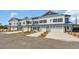 New townhome row features a neutral color scheme, personal driveway, and attached garage at Tbb Lineback Pl. # 32, Longs, SC 29568