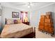 The bedroom offers neutral walls, carpet, and a closet at 1005 S Main St., Mullins, SC 29574