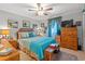 Comfortable bedroom featuring neutral walls and warm wood accents at 1005 S Main St., Mullins, SC 29574