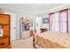 Bedroom with an airy feel, featuring a vintage bookshelf and neutral tones at 1005 S Main St., Mullins, SC 29574