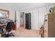 Neutral bedroom with lots of natural light, closet, and door to another room at 1005 S Main St., Mullins, SC 29574