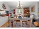 Bright dining area with an antique hutch and a view into the kitchen at 1005 S Main St., Mullins, SC 29574
