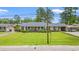 Exterior view of a brick home with a well-manicured front yard at 1005 S Main St., Mullins, SC 29574
