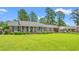 Well-maintained brick home with a lush front lawn and inviting curb appeal at 1005 S Main St., Mullins, SC 29574