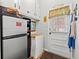 This laundry area has storage cabinets and a door that leads to the outside at 1005 S Main St., Mullins, SC 29574