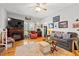 Inviting living room with hardwood floors, a cozy fireplace, and comfortable seating for relaxing and entertaining guests at 1005 S Main St., Mullins, SC 29574