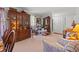 Cozy living room with wood furniture, crown molding, and bright natural light at 1005 S Main St., Mullins, SC 29574