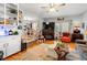 Comfortable living room boasts hardwood floors, a fireplace, and a view into the dining area and kitchen at 1005 S Main St., Mullins, SC 29574